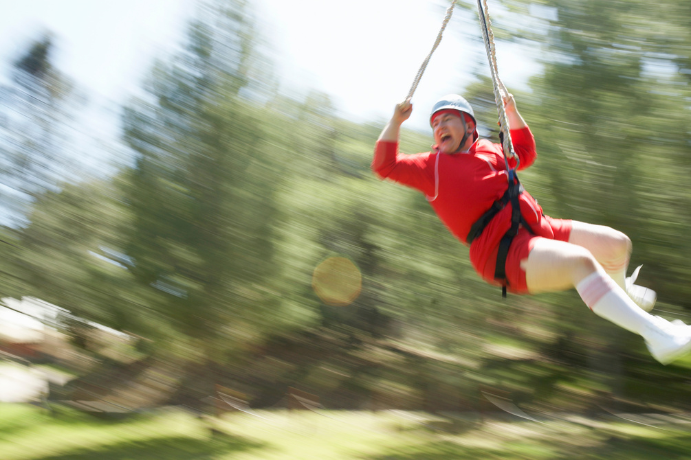 Man going through zipline